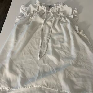 White sleeveless sheer blouse with tie in the front strings